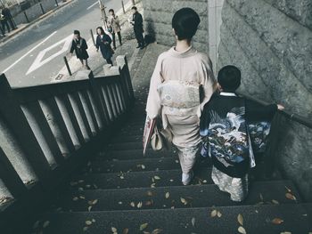 High angle view of girl walking on road