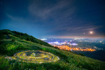 High angle view of townscape against sky at night