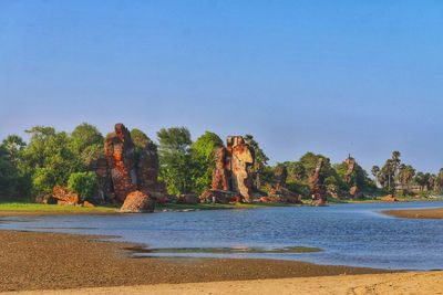 Scenic view of calm sea against clear sky
