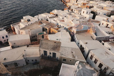 High angle view of buildings by sea