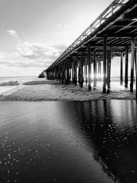 Pier over sea against sky