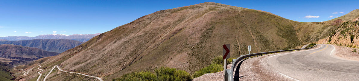 Scenic view of mountain road against sky