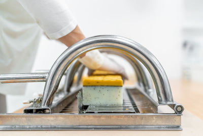 Close-up of person preparing food in kitchen