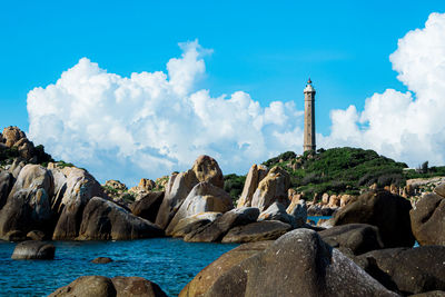 Panoramic view of rocks against blue sky