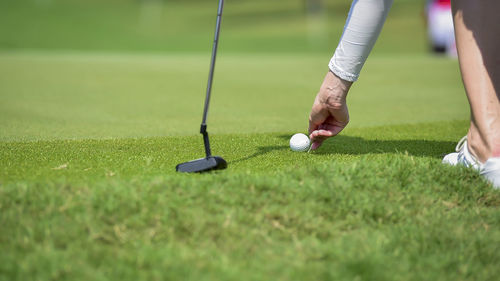 Low section of person playing golf