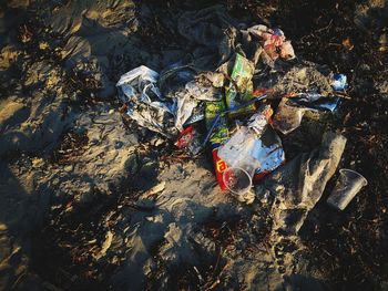 High angle view of garbage on rock