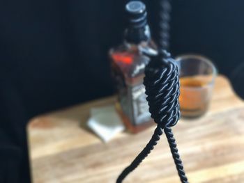 Close-up of rope against black background