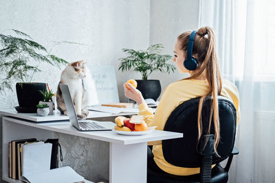 Mental health and work. work life balance. young woman in headphones near laptop at home office