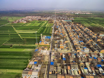 High angle view of buildings on field