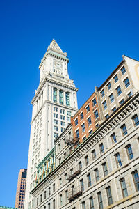 Low angle view of building against blue sky