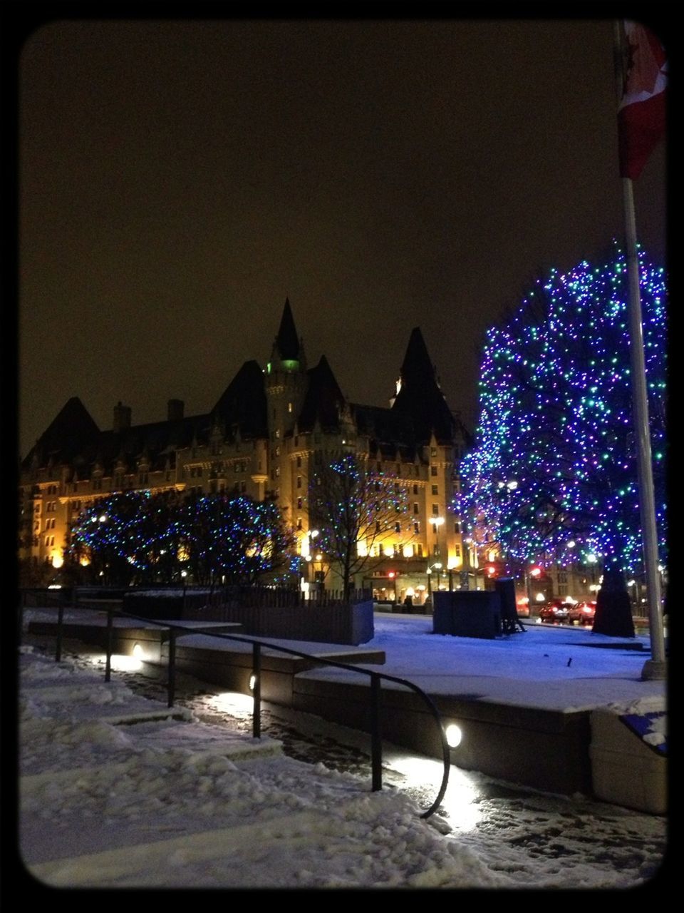 illuminated, night, building exterior, architecture, built structure, city, lighting equipment, clear sky, street light, sky, outdoors, celebration, city life, light - natural phenomenon, incidental people, tree, decoration, transfer print, copy space, dusk