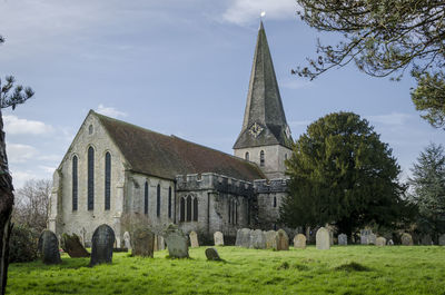 The church of all saints in the village of woodchurch, kent, uk