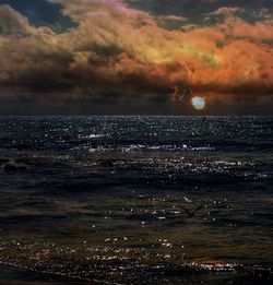 Scenic view of sea against dramatic sky