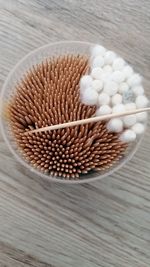 Close-up of wooden object on white surface