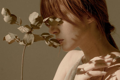 Close-up of woman standing by plants