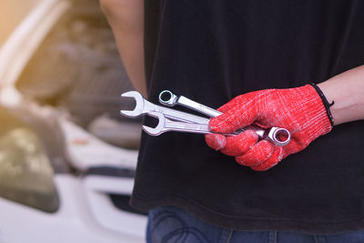 Close-up of man holding umbrella