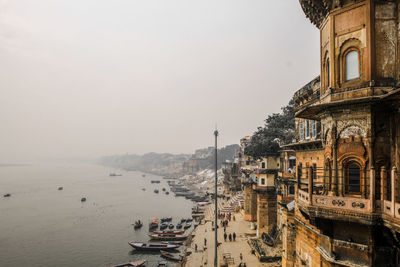 Panoramic view of buildings and sea against sky