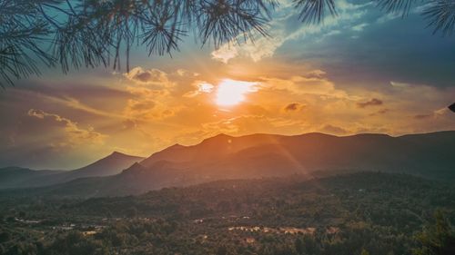 Scenic view of landscape against sky during sunset