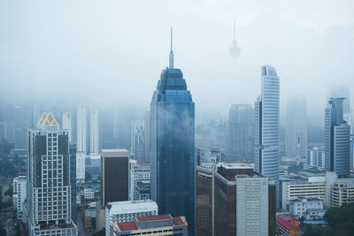 Modern buildings in city against sky