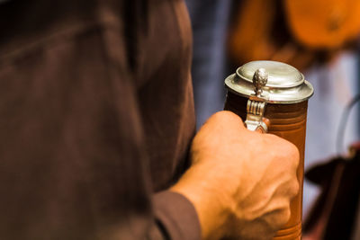 Midsection of man working at home