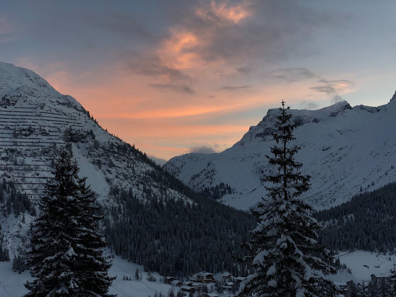 SCENIC VIEW OF MOUNTAINS DURING WINTER AGAINST SKY