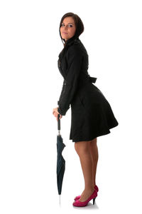 Full length portrait of woman standing against white background