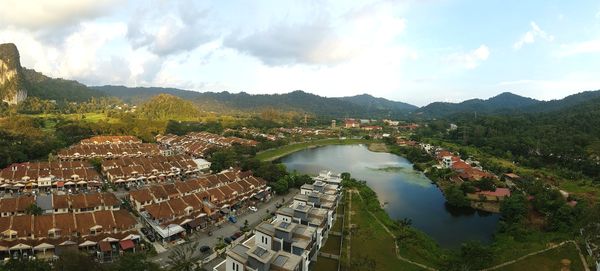 High angle view of river by town against sky