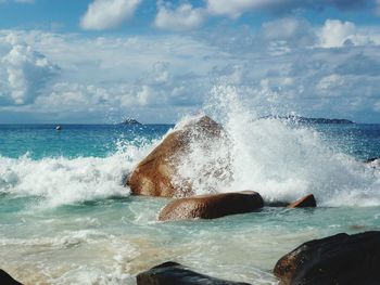 Waves breaking against sea