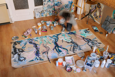 High angle view of woman sitting on table at home