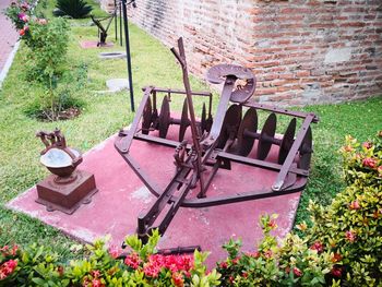 High angle view of old wall and bench in yard