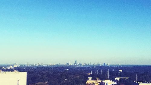 View of cityscape against clear sky