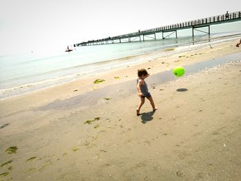 Boy playing on beach