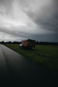 Car on landscape against sky