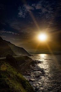 Scenic view of sea against sky at sunset