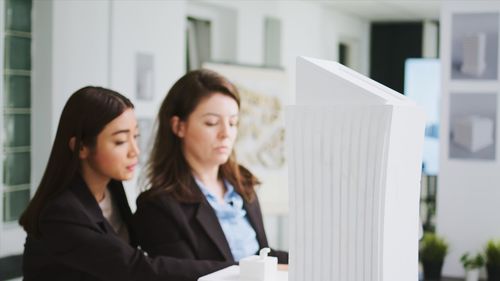 Businesswoman using laptop at office