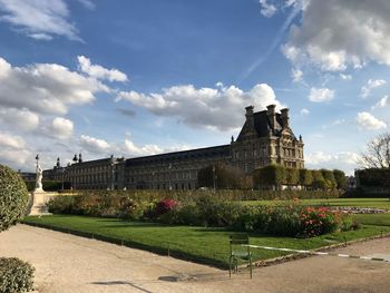 View of buildings against cloudy sky