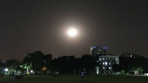 View of buildings lit up at night