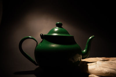 Close-up of drink on table against black background