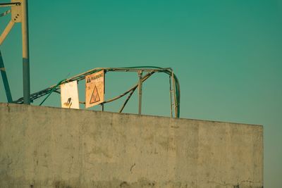 Low angle view of old building against green sky