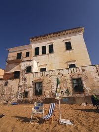 Low angle view of old building against clear blue sky in sud of italy, made in italy