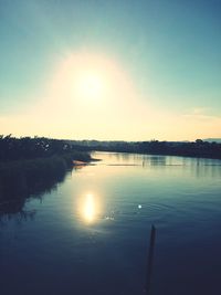 Scenic view of lake at sunset