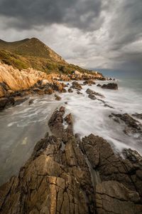 Scenic view of sea against cloudy sky