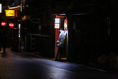 Man in illuminated room at night