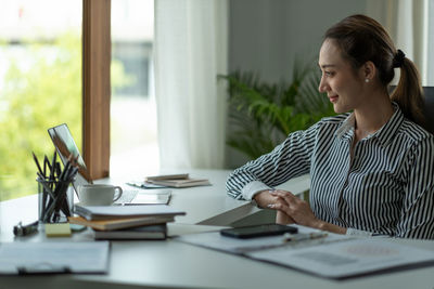 Businesswoman working on table