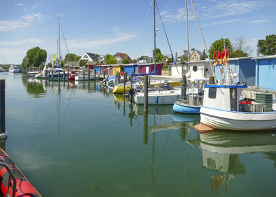 Boats moored at harbor