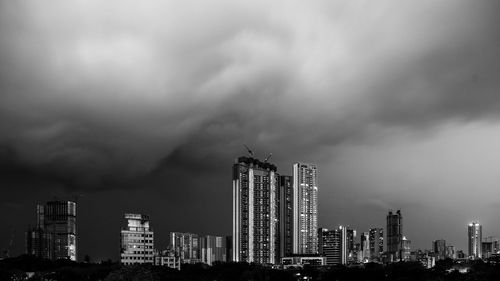 Modern buildings in city against sky