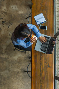 High angle view of man using mobile phone