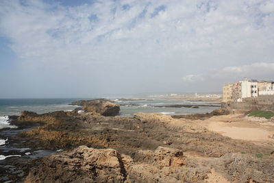 Scenic view of sea against cloudy sky