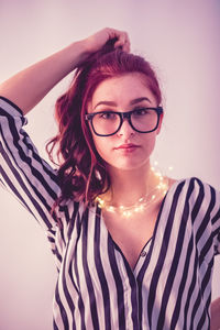 Portrait of young woman wearing eyeglasses