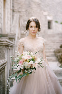 Portrait of young woman standing in traditional clothing